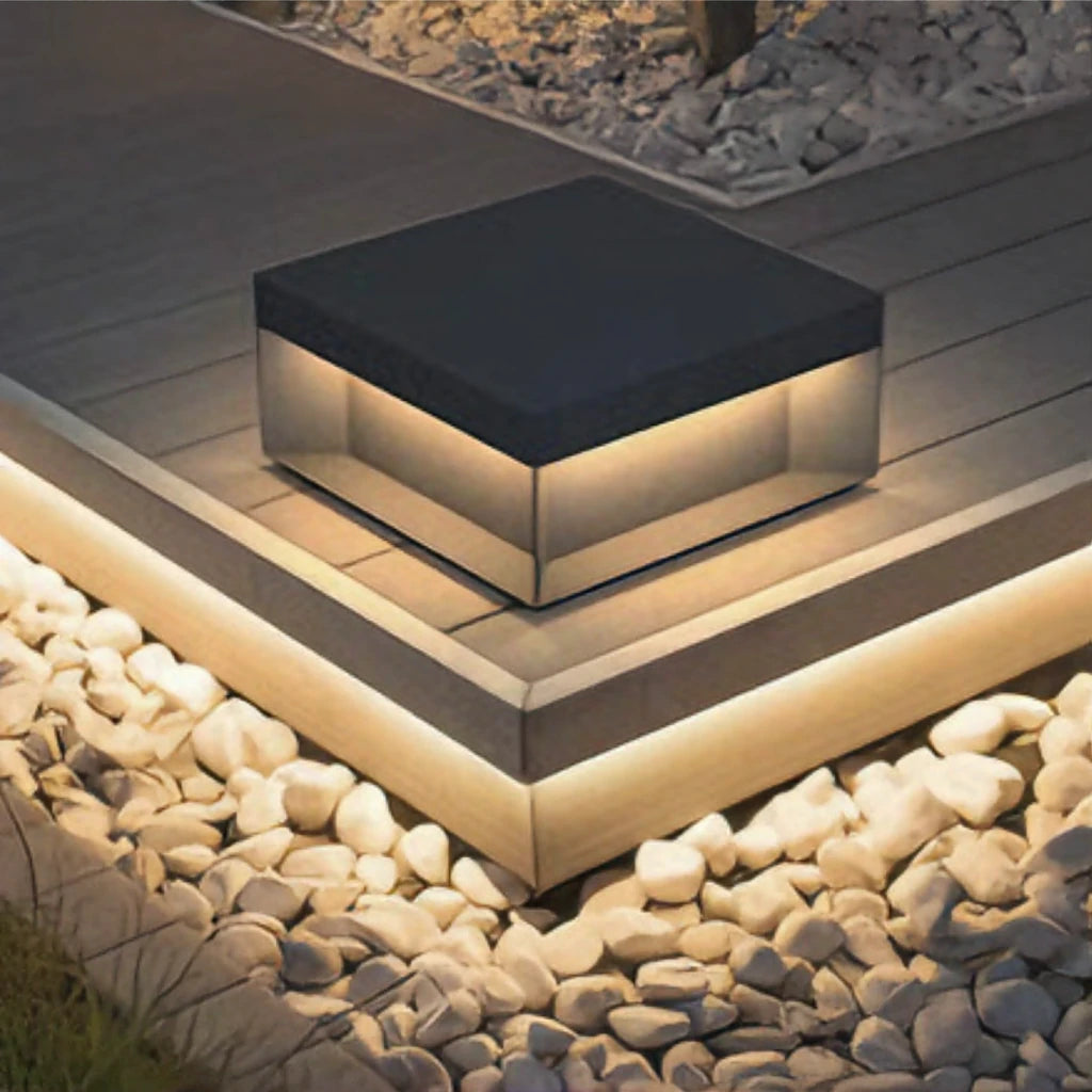 Outdoor LED light on the corner of garden decking, washing light down onto the boards