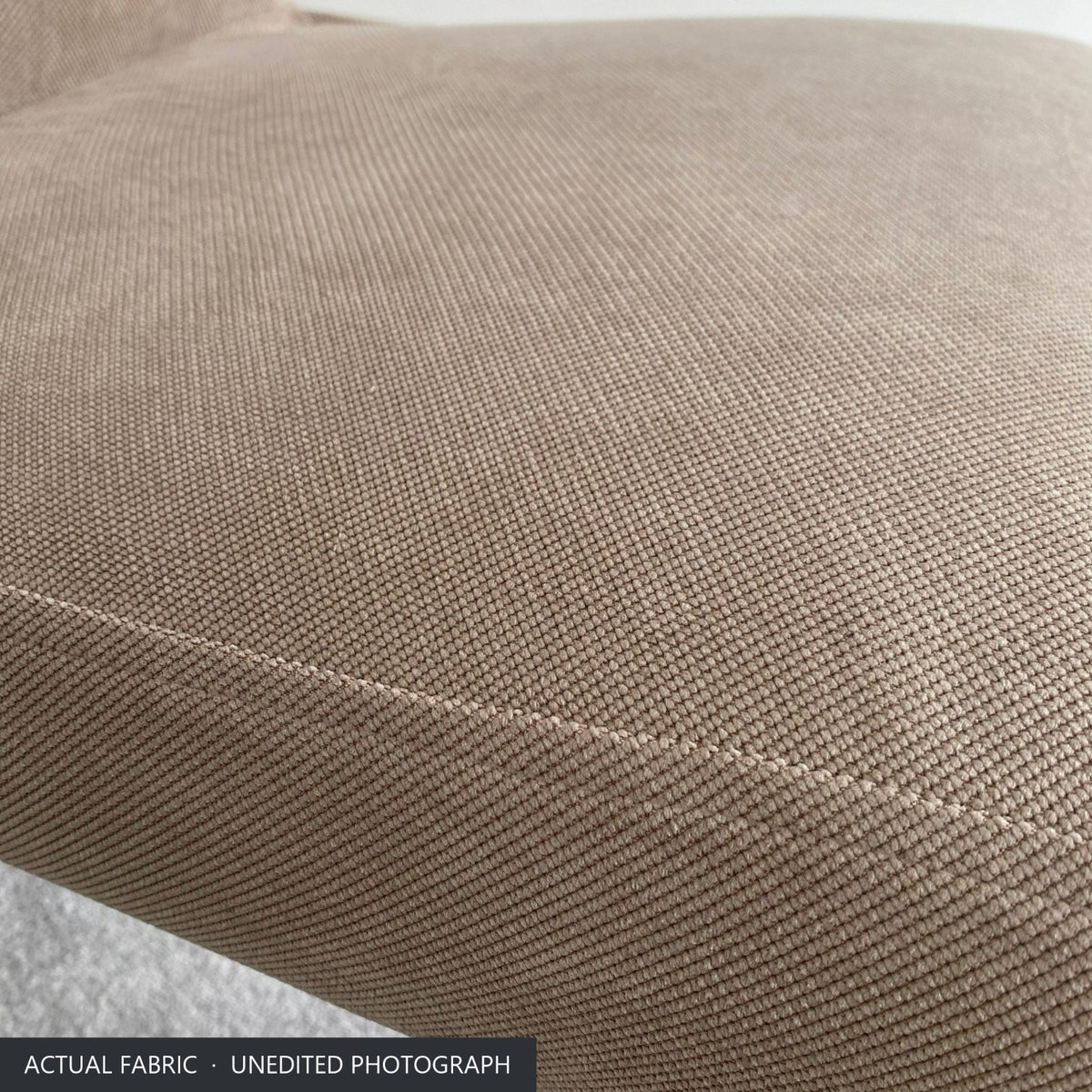 Close-up of the warm taupe stretch-woven polycotton on the seat of the Bergmund chair cover