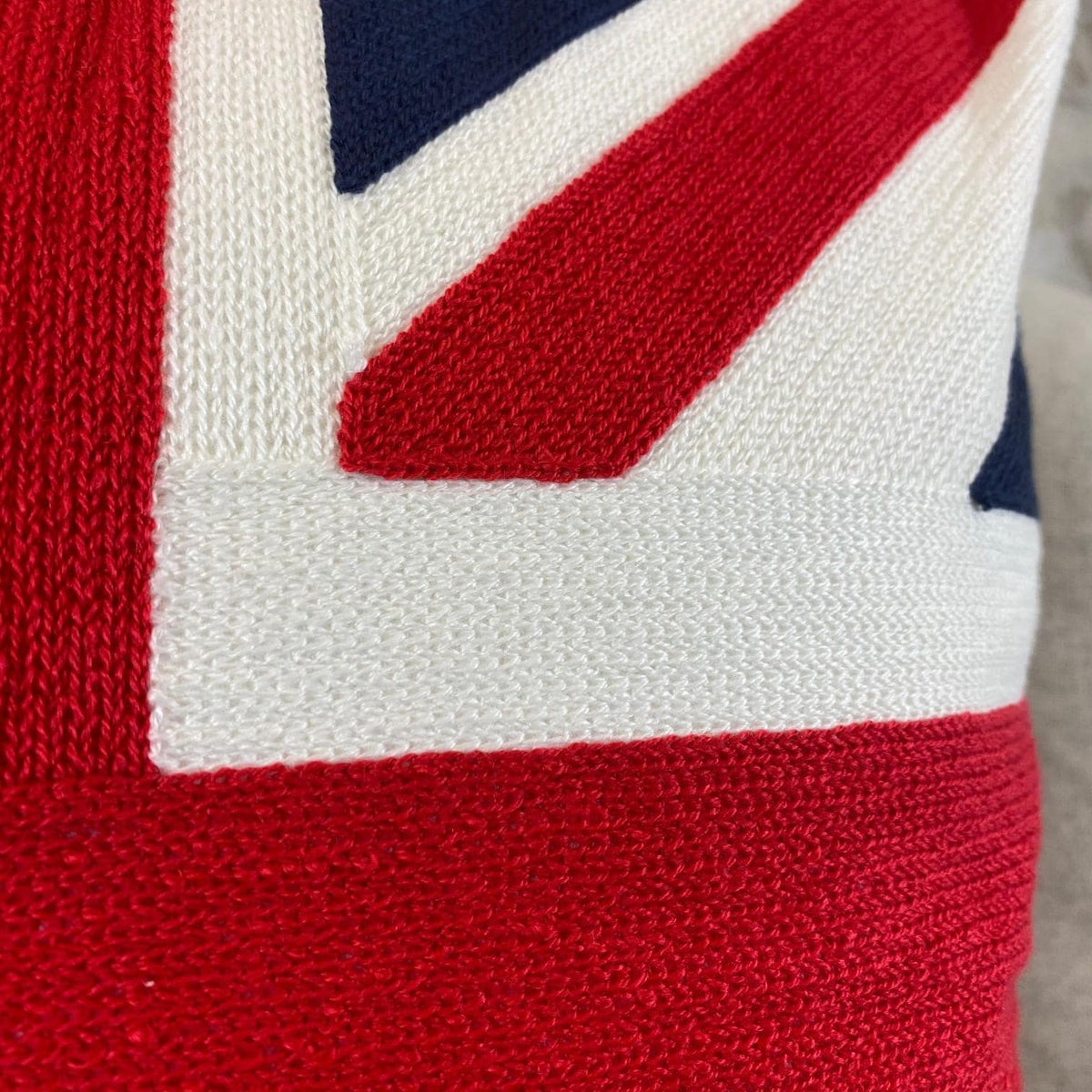 Close-up of the stitched red, white and navy embroidery on the Union Jack cushion