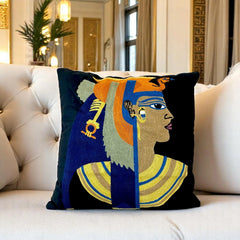 Black Cleopatra cushion cover on a buttoned cream sofa in a gold-toned Egyptian-style room
