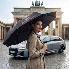 Audi compact folding umbrella in use — Black, ideal for the commute, course and travel