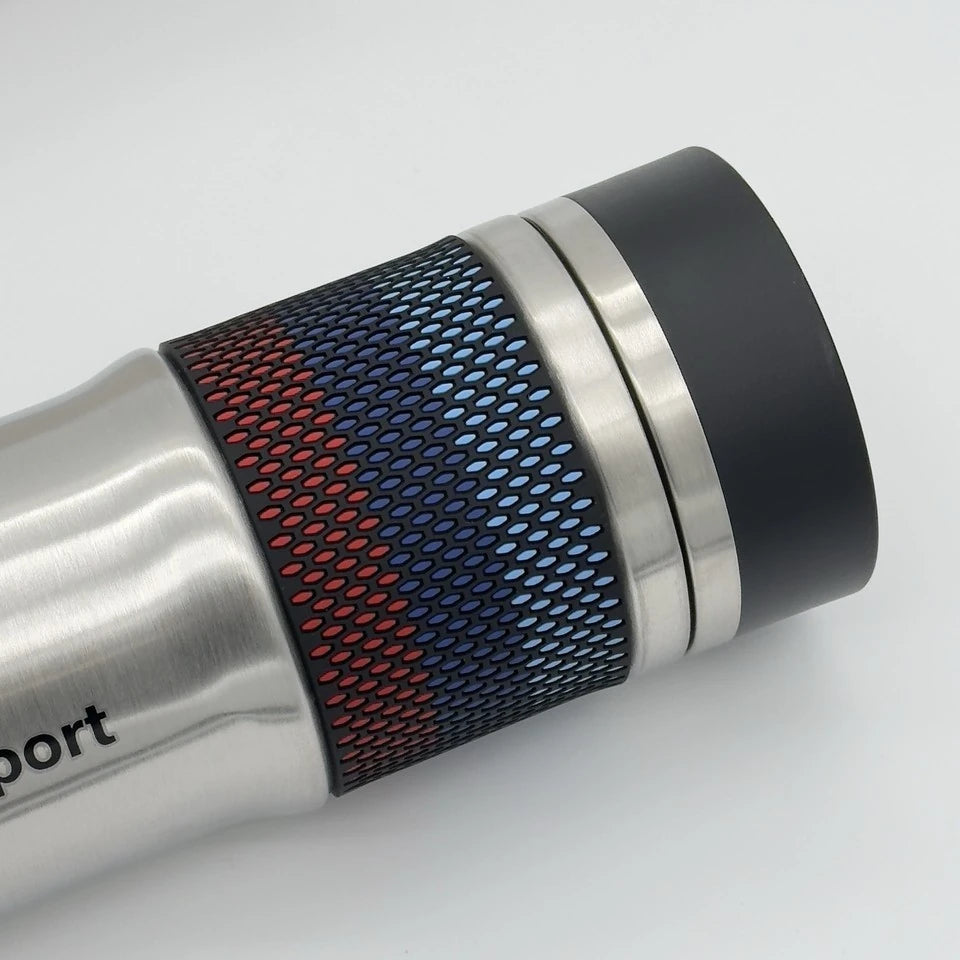 Close-up of the thermos mug's textured silicone grip band in light blue, dark blue and red BMW M colours
