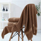 Brown bamboo bath towels displayed — luxury spa-quality bathroom set