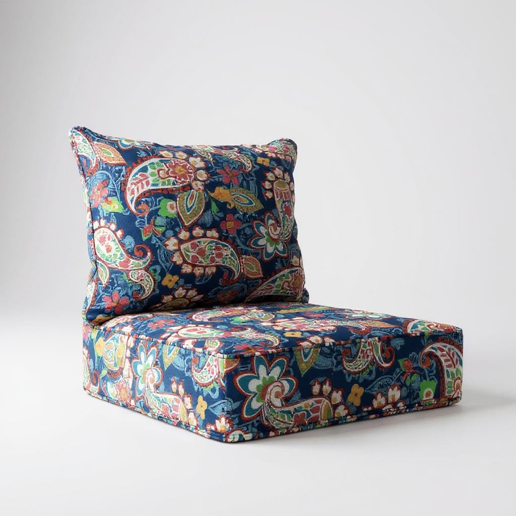 Outdoor seat and back cushion set in navy paisley floral, three-quarter view of the thick foam seat