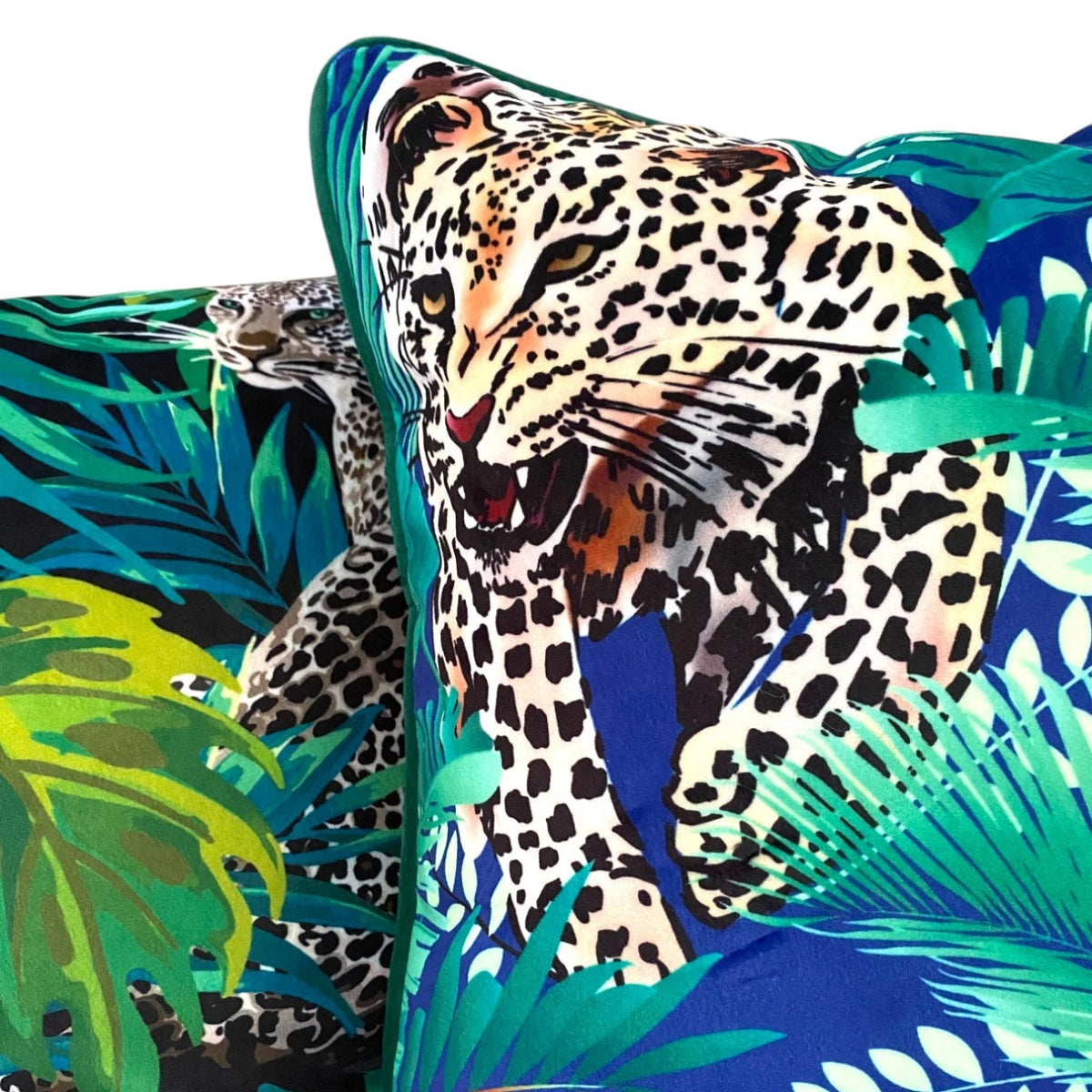 Close-up of the leopard print velvet cushion cover showing the soft pile, royal blue ground and green piping