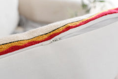 Concealed zip and plain off-white back of the embroidered cotton cushion cover