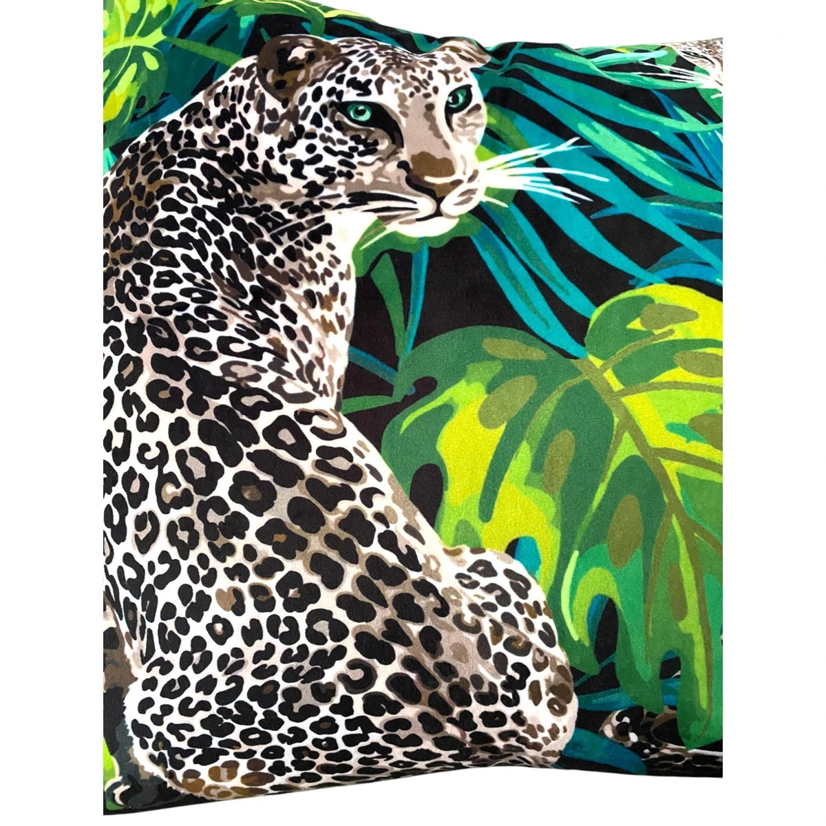 Close-up of the leopard jungle print velvet cushion cover: lime and emerald monstera leaves on a black ground