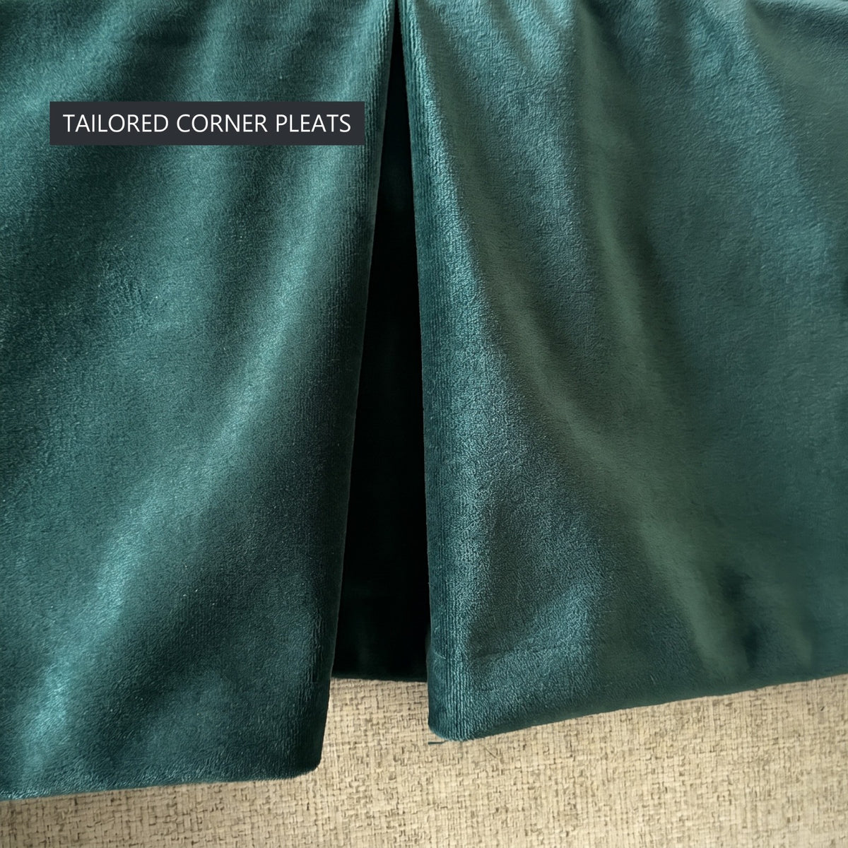 Close-up of the tailored corner pleats on the skirt of the bottle green velvet Ektorp sofa cover