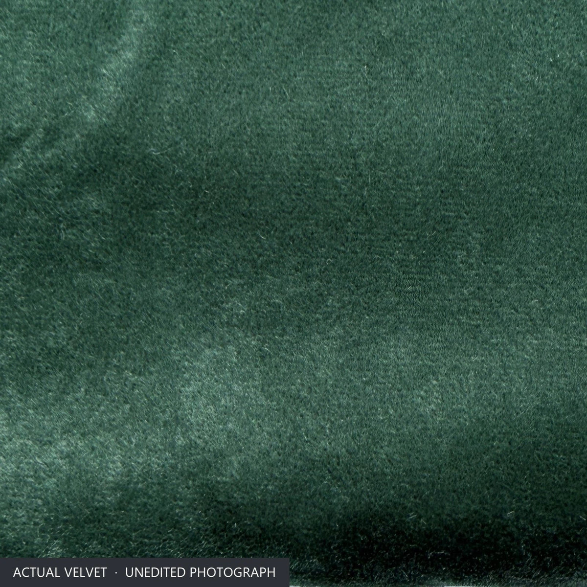 Unedited close-up of the bottle green velvet on the Ektorp sofa cover, showing the dense pile and soft sheen