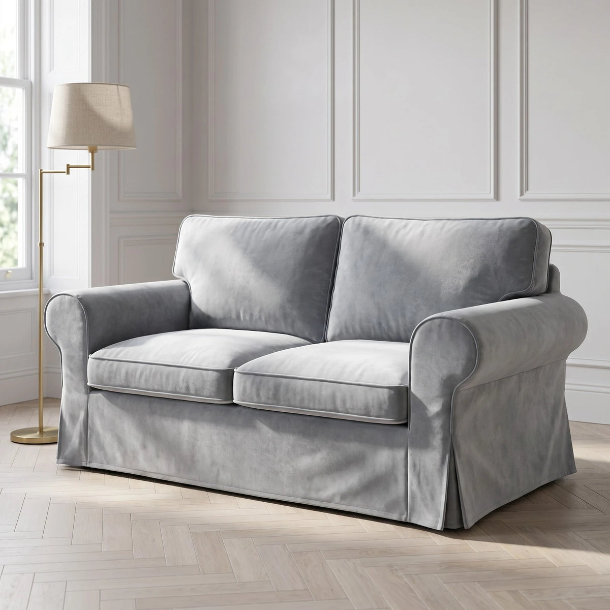 Grey velvet IKEA Ektorp slipcover on a 2 seater sofa in a panelled living room with a brass floor lamp