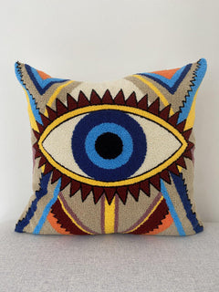 Evil eye cushion cover 50x50 cm with a tufted nazar design in blue, yellow and burgundy, front view
