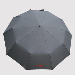 Grey compact umbrella from above, showing the 10-panel UV-resistant canopy and red HideWise London logo