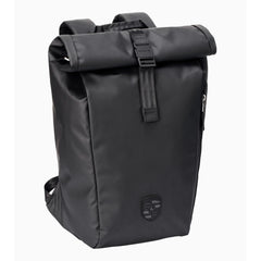 Porsche 911 roll-top backpack in black, front view with the 3D Porsche Crest and clip-closure roll top