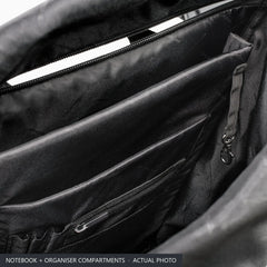 Inside the Porsche roll-top backpack: separate padded notebook compartment, organiser pockets and key clip