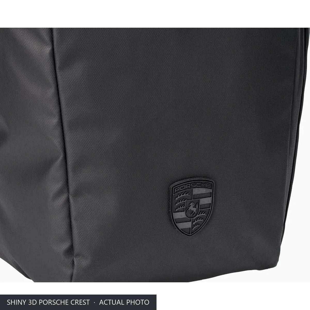 Shiny 3D Porsche Crest on the front of the 911 roll-top laptop backpack, close-up