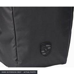 Shiny 3D Porsche Crest on the front of the 911 roll-top laptop backpack, close-up