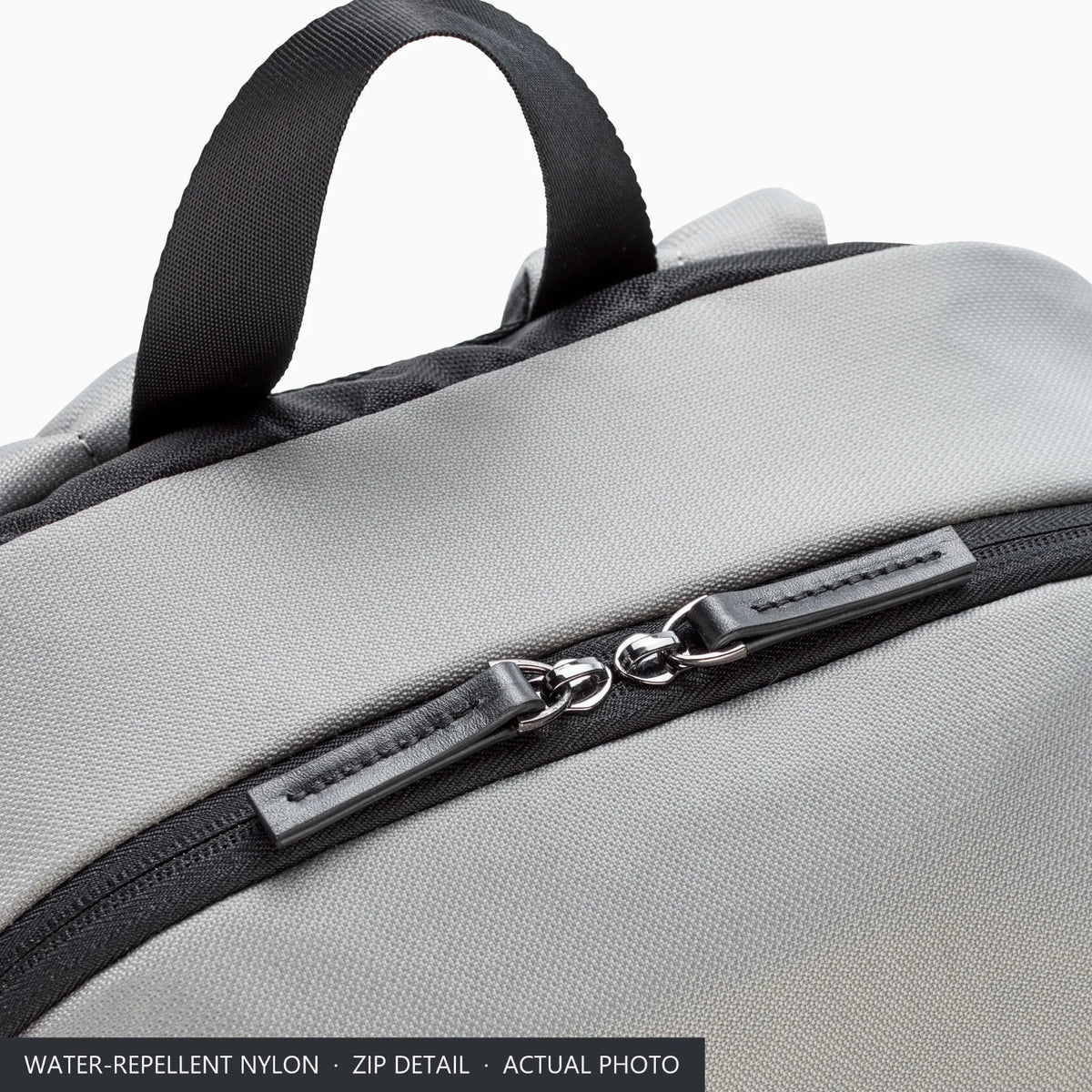 Water-repellent grey nylon and twin zip pullers on top of the Porsche Turbo No. 1 backpack