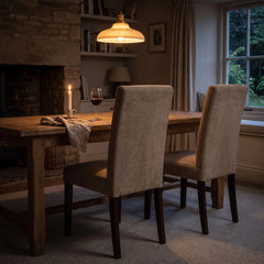 Beige taupe chair covers on Bergmund dining chairs at a candlelit table