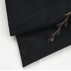 Black velvet Klippan cover — soft folded fabric texture detail