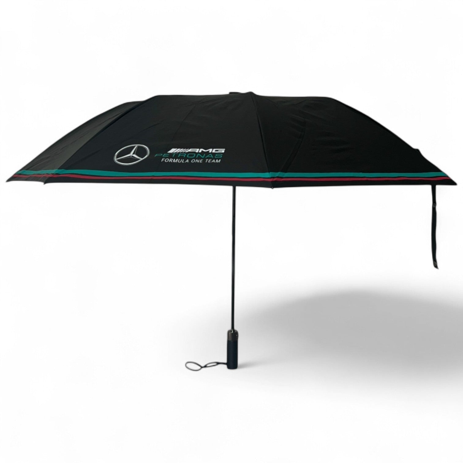Black umbrella with Mercedes-Benz AMG Petronas Formula One Team branding on a white background